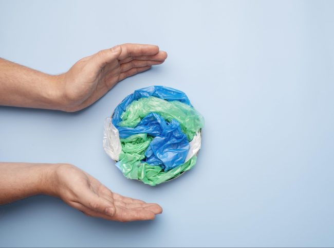 photo of hands with hand with plastic pa/pe earth