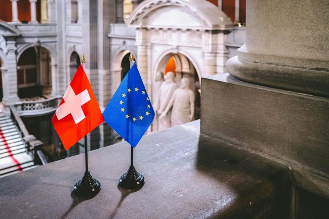 Swiss amendments - EU and Swiss flags

