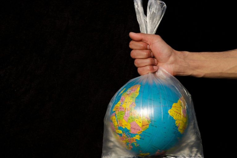 bag wrapped around globe - EU Signs Bridge to Busan Declaration to Control Plastic Production