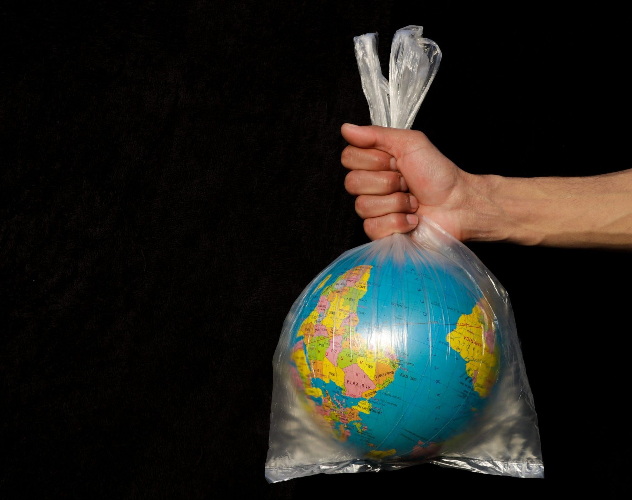 bag wrapped around globe - EU Signs Bridge to Busan Declaration to Control Plastic Production