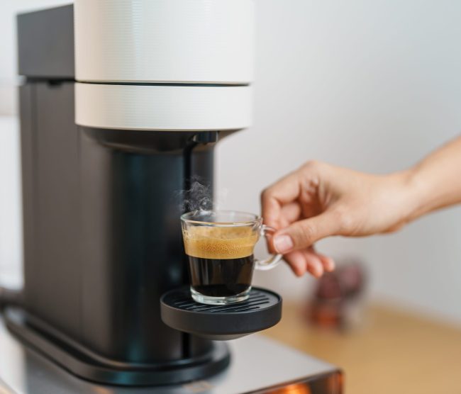 Espresso cup with steam aduring Coffee making - k-cup sustainability fine