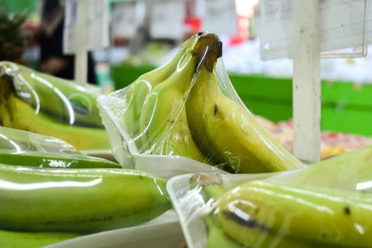 vecteezy_banana-in-plastic-wrap-displayed-in-supermarket_43309060 Plastic Packaging for Fresh Produce - bananas