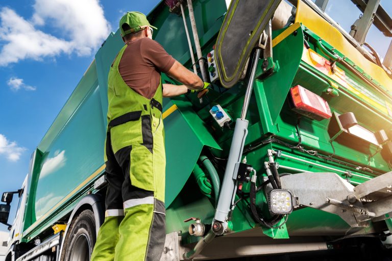 worker unloading garbage - PackUK
