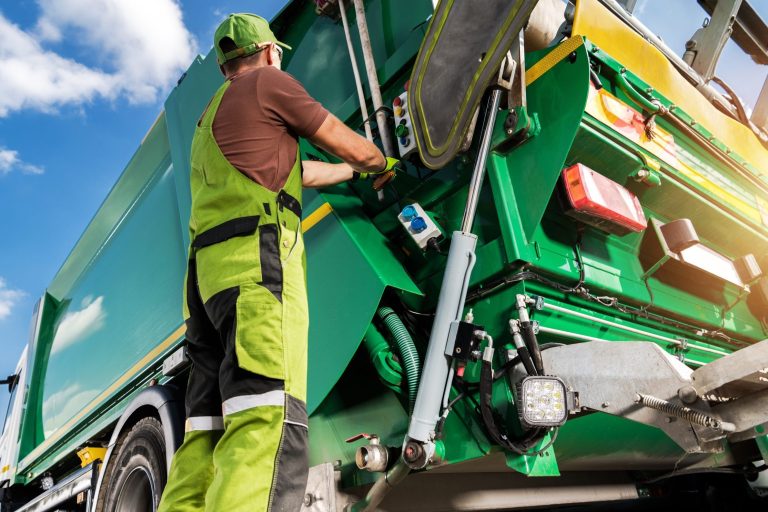worker unloading garbage - PackUK 