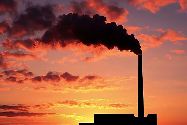Industrial factory chimney releasing pollution at sunset -  Toxic Pollution Around Waste Incinerators in Europe