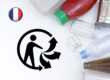 The Triman sorting symbol alongside recyclable consumer products and a French flag icon, illustrating the European Commission's infringement action against France over the mandatory Triman logo requirement.