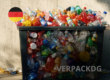 Overflowing recycling bin with German flag and VerpackDG text, representing Germany's new packaging law that entered into force on 12 August 2026.