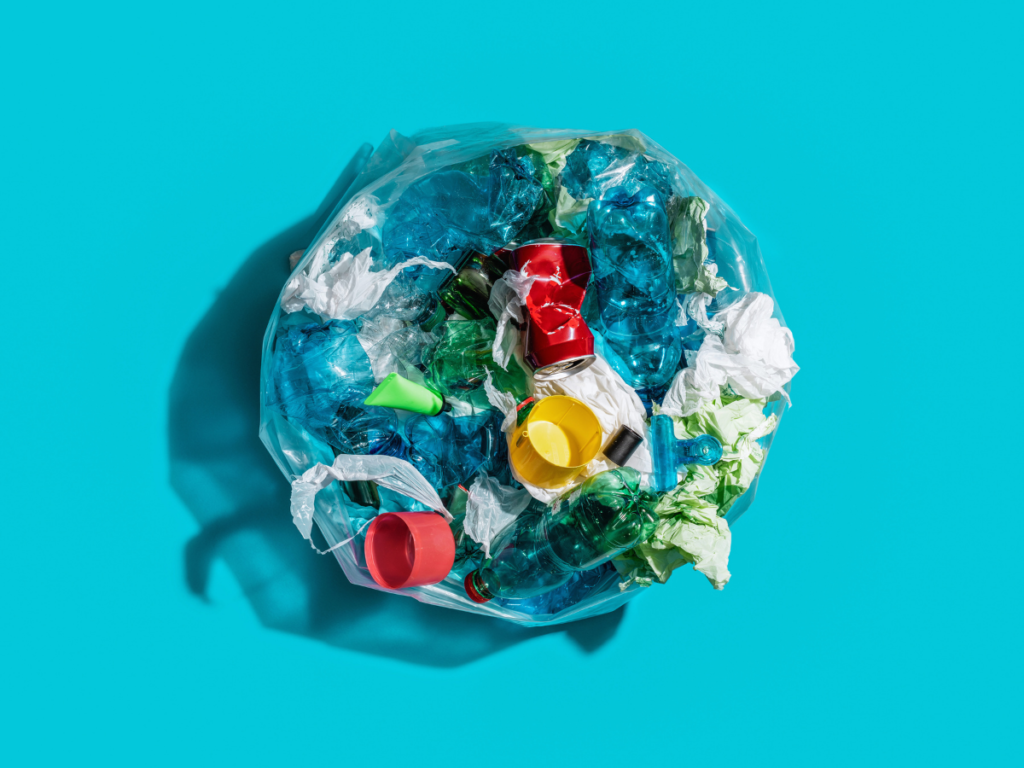 Plastic packaging waste collected in a bag, representing the PPWR recycled content rules that the European Commission is developing through three calls for evidence.