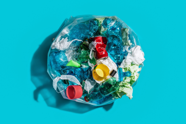 Plastic packaging waste collected in a bag, representing the PPWR recycled content rules that the European Commission is developing through three calls for evidence.